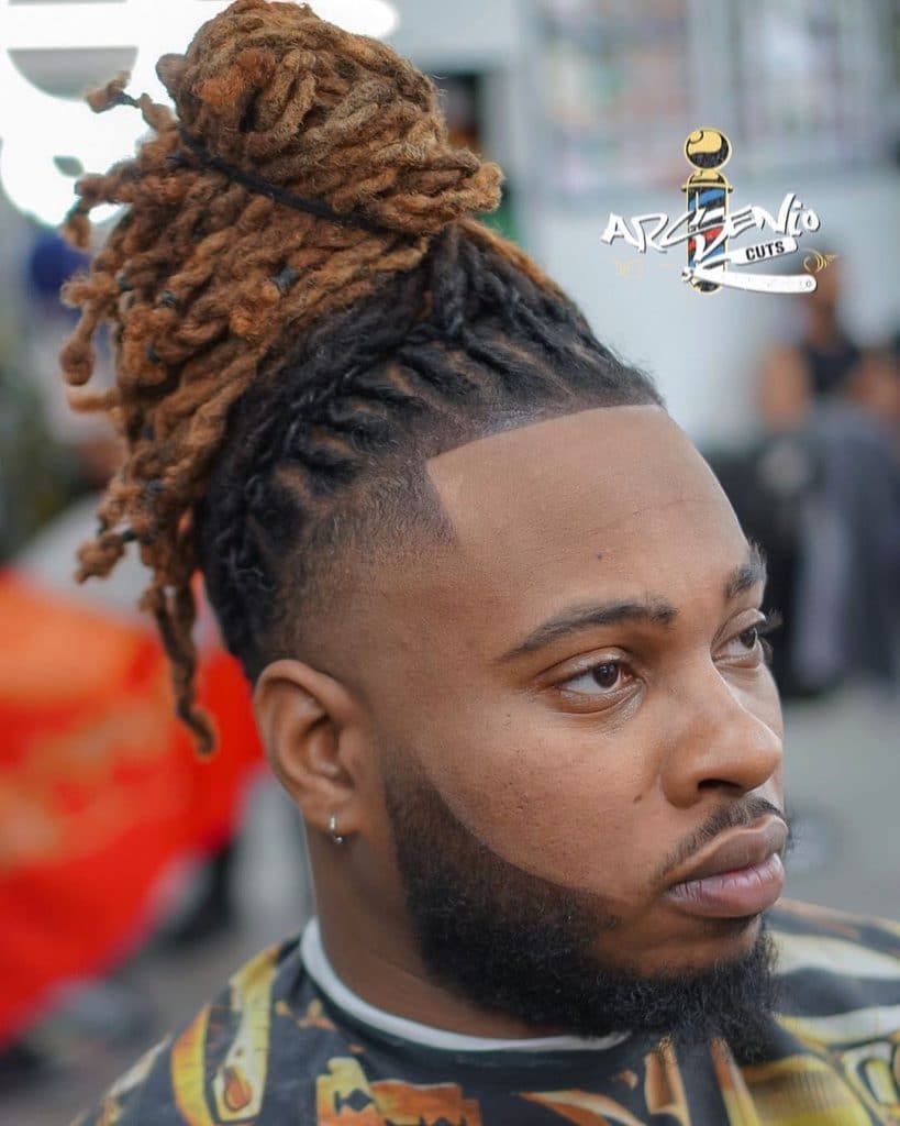 Bald temple fade haircut with long dreadlocks