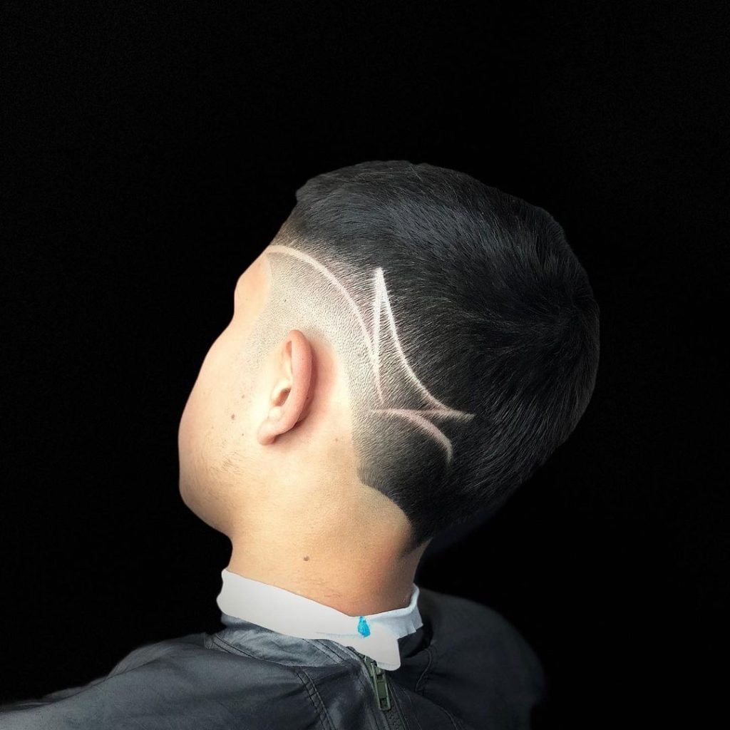 Buzz cut fade with hair design