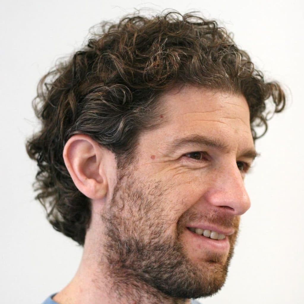 Medium length curly hair men