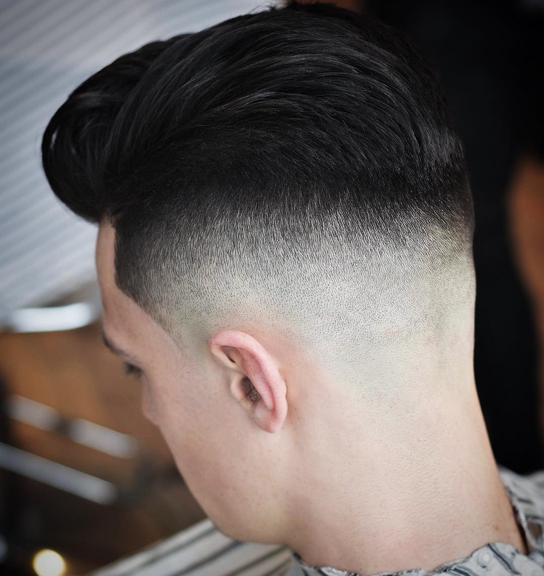 High skin fade with medium long hair