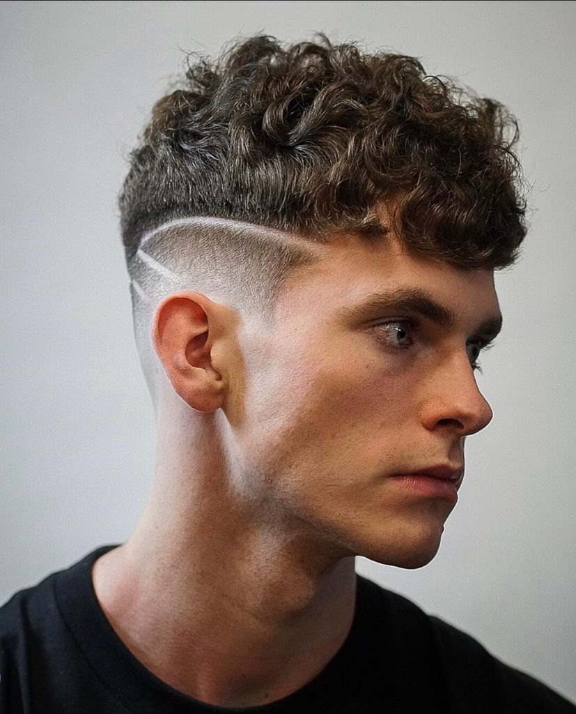 Curly drop fade haircut with hair design