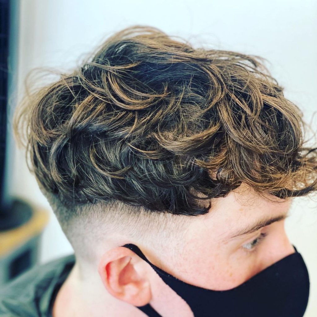 Hidden undercut fade for curly hair