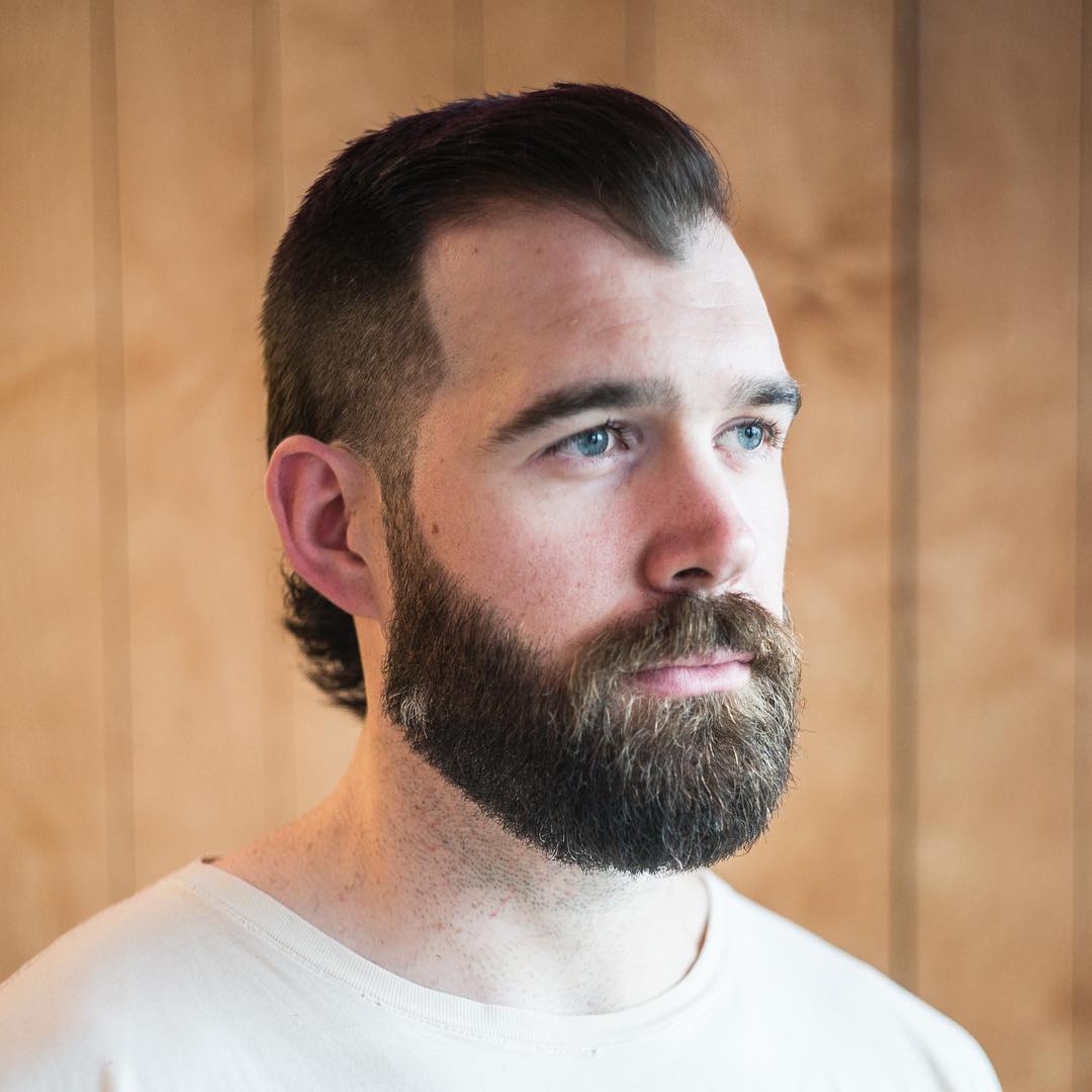 Short mullet haircut and beard