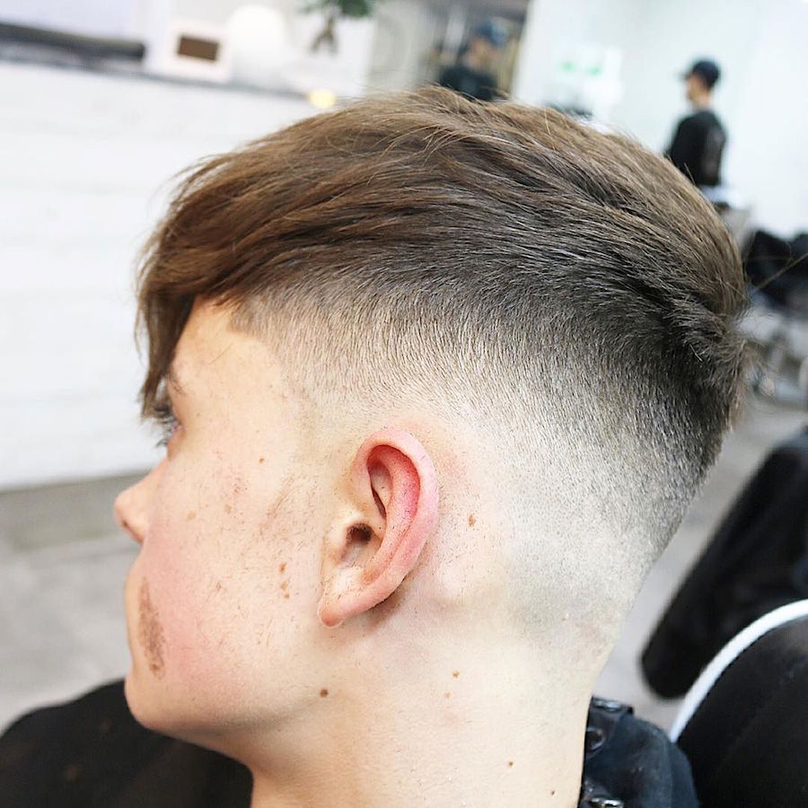 menspiresalon_and high fade blended into medium hair on top longer fringe