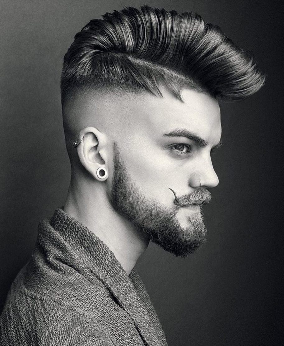 Pompadour hairstyle with high bald fade