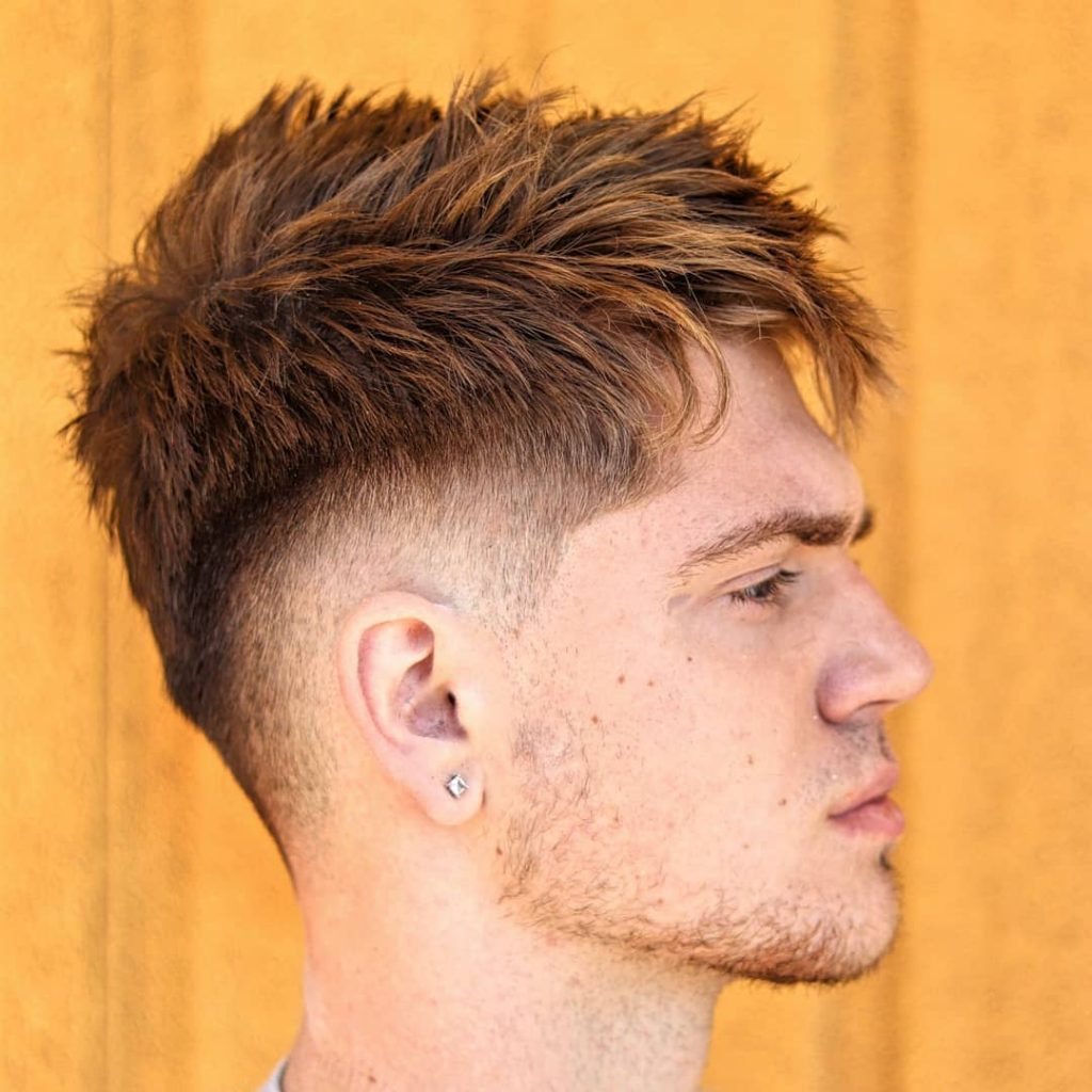 Textured fade hairstyle with a drop fade