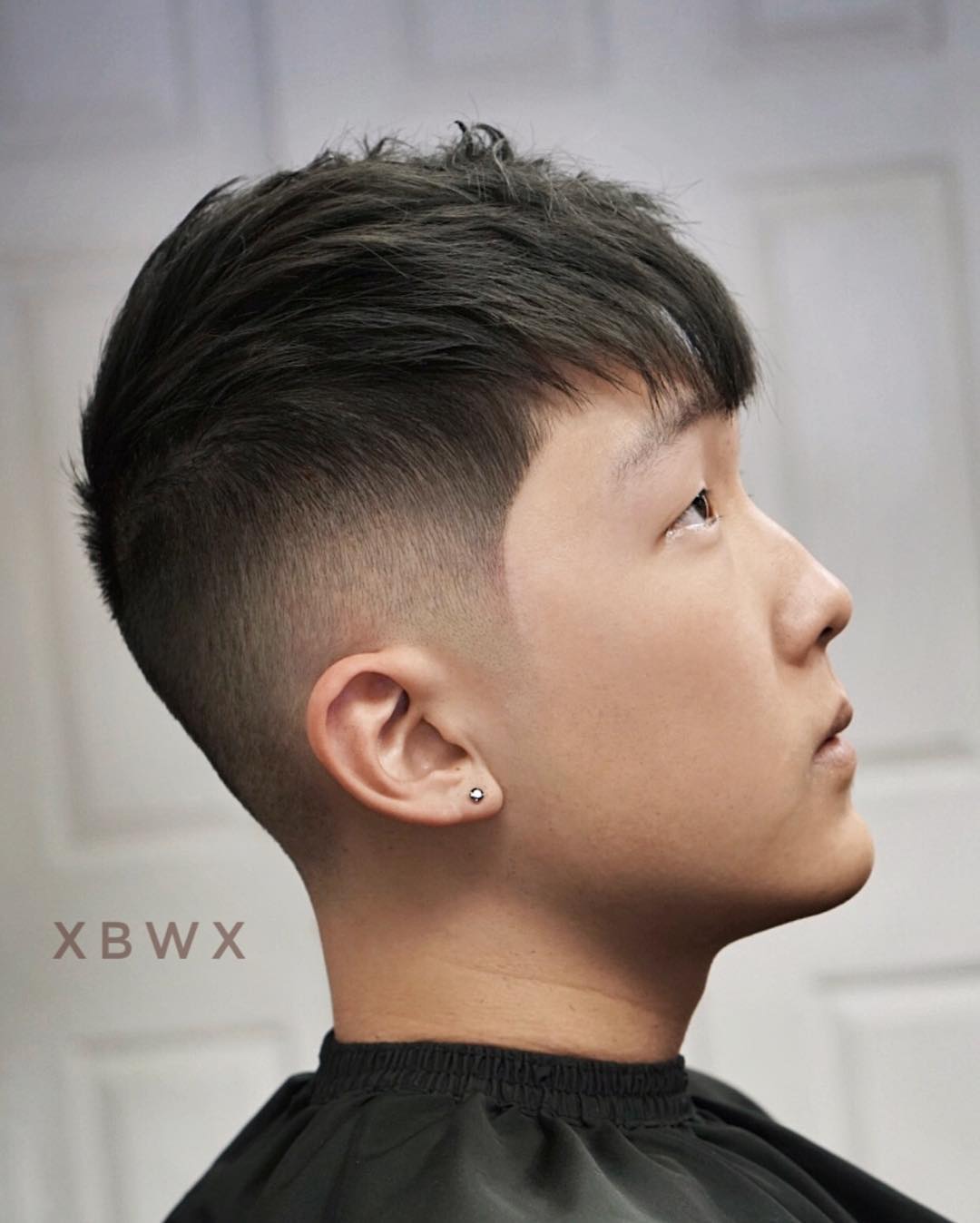 Medium textured haircut mid fade